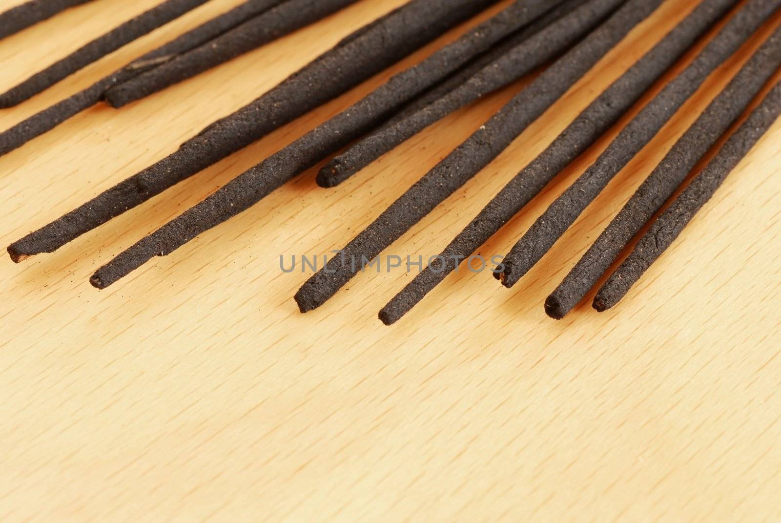 lot of incense sticks unlit on brown table