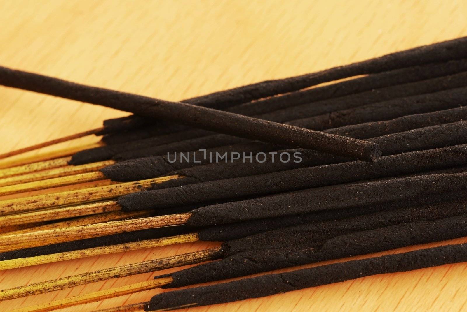 lot of incense sticks unlit on brown table