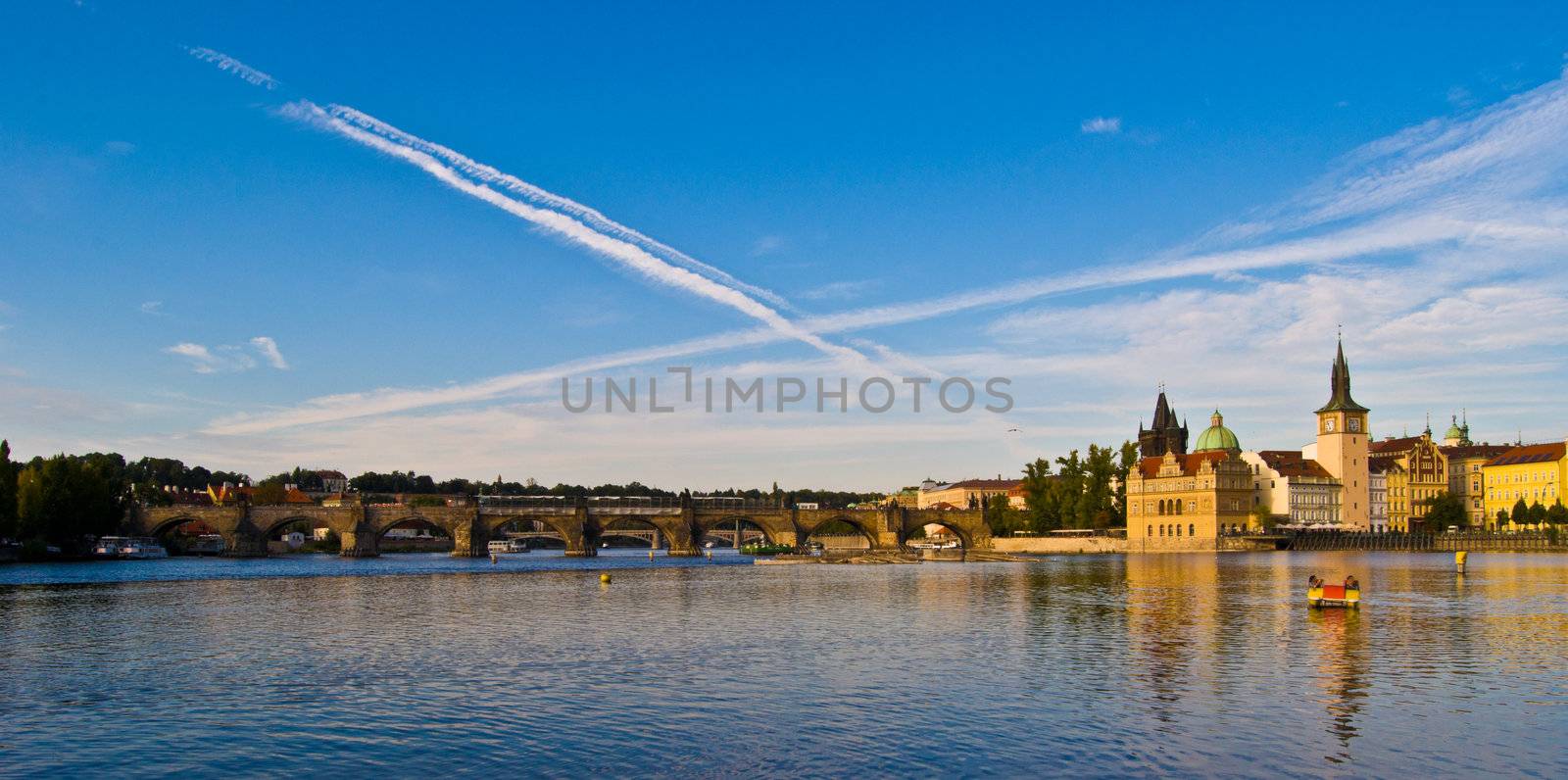 view of Prague and the Vltava  in the evening