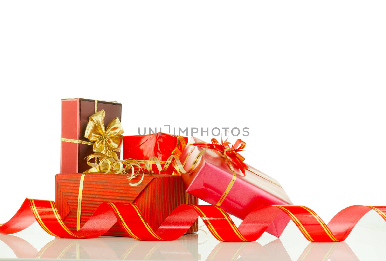 Christmas presents in red boxes against white background