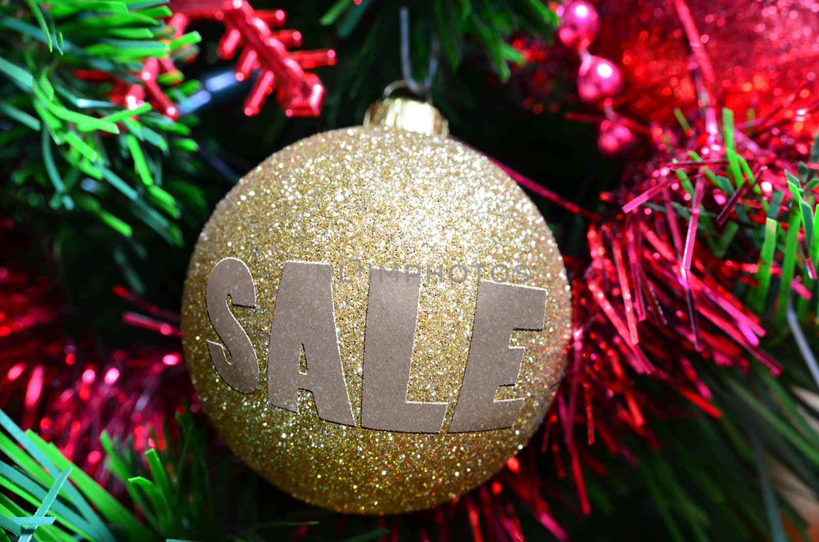 Golden Christmas ball with sale written on it