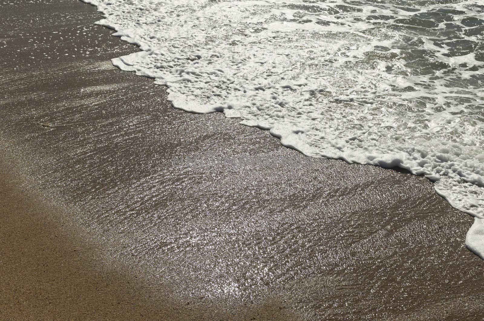 Closeup of beautiful white sea foam and waves