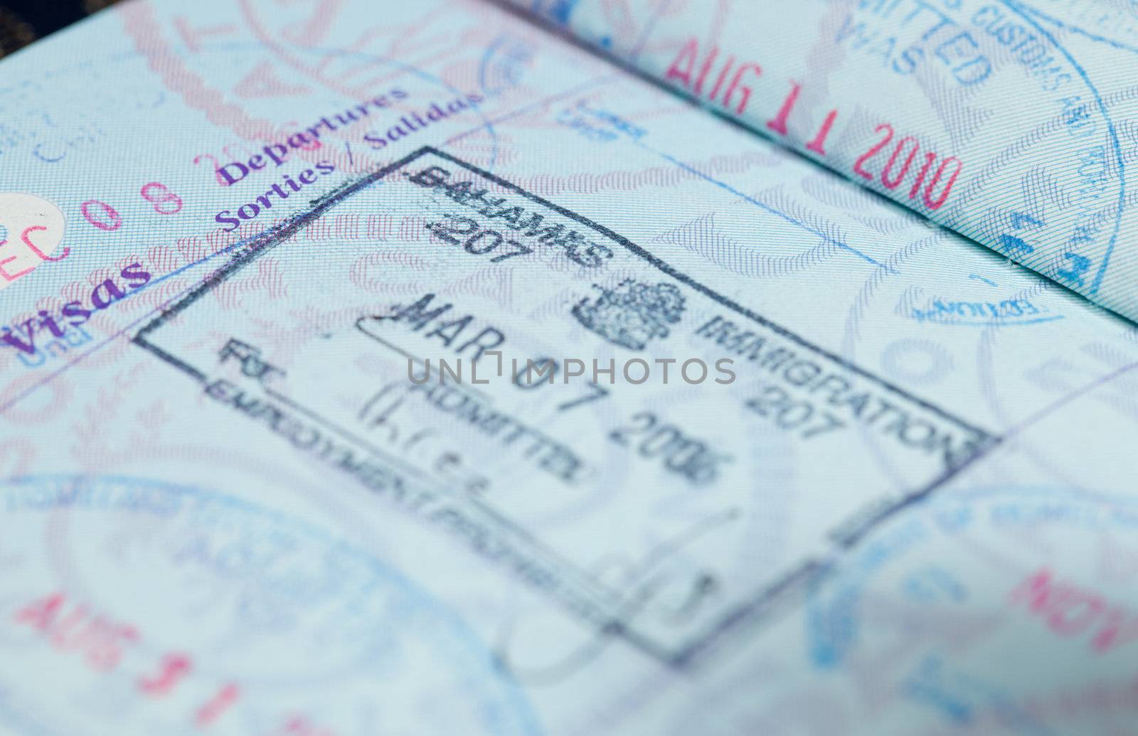 Macro image of visa and immigration stamps in US passport for Bahamas