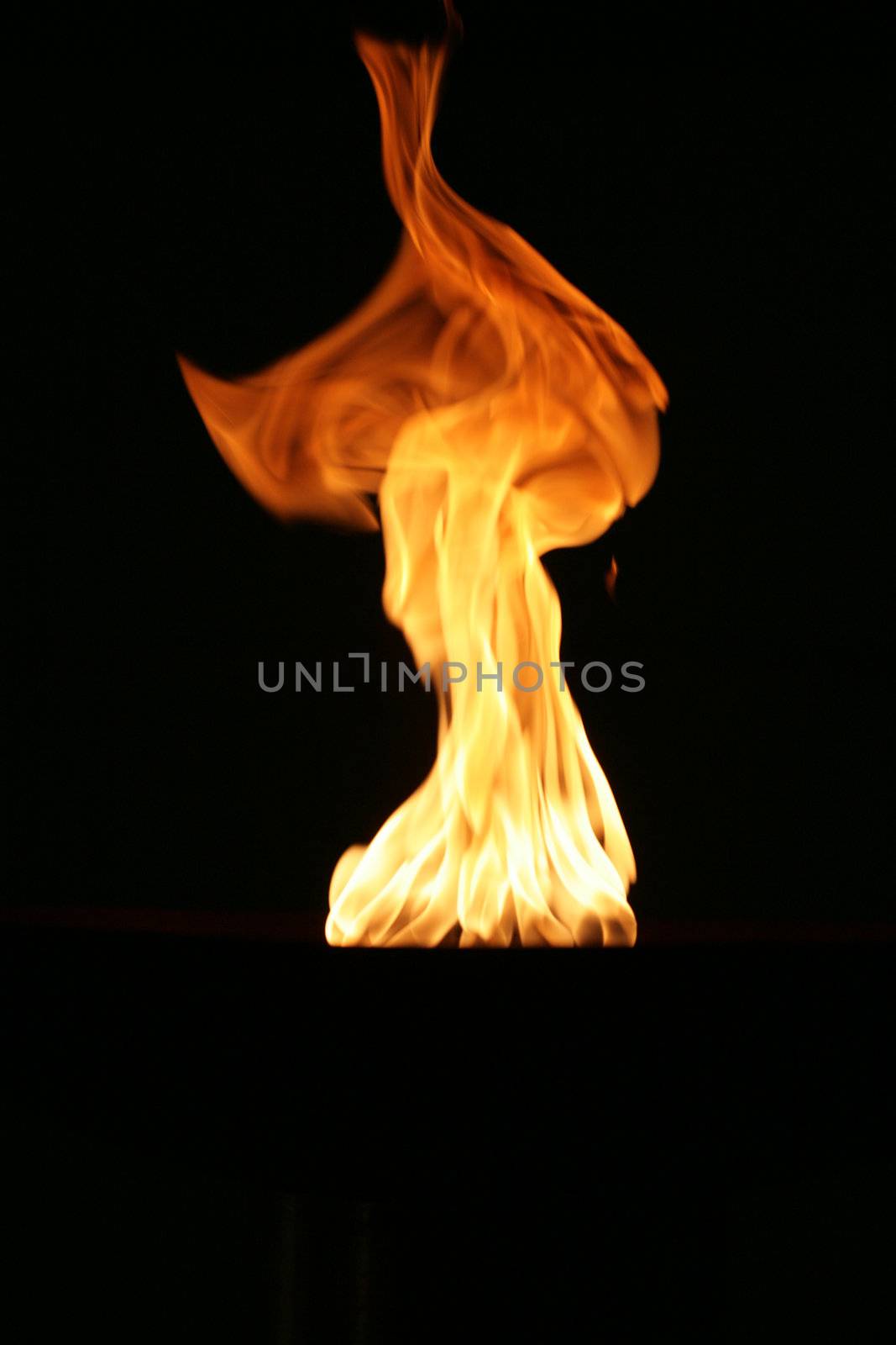 gas flame burning on a dark background
