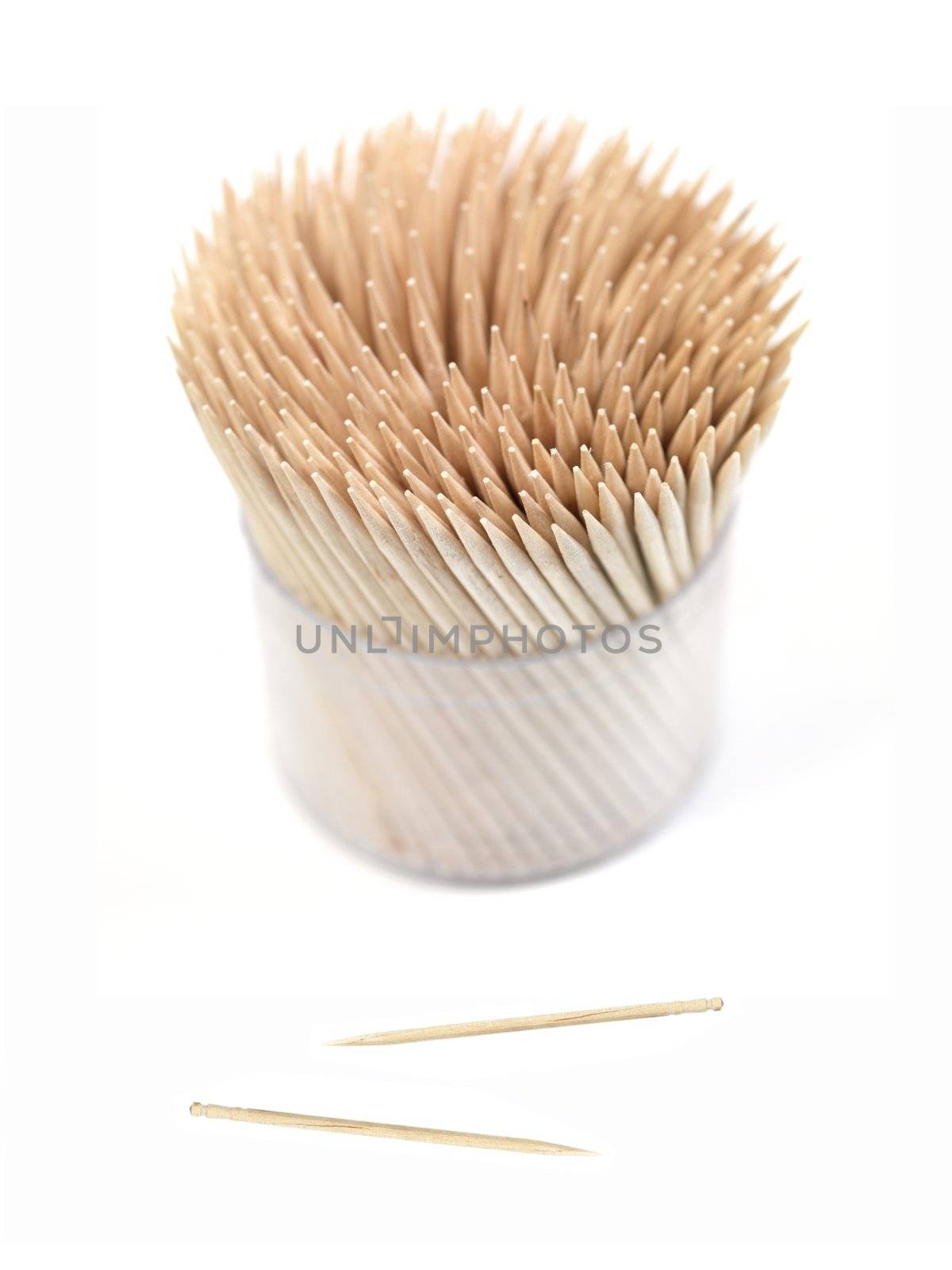 A close up shot of a wooden toothpicks on white