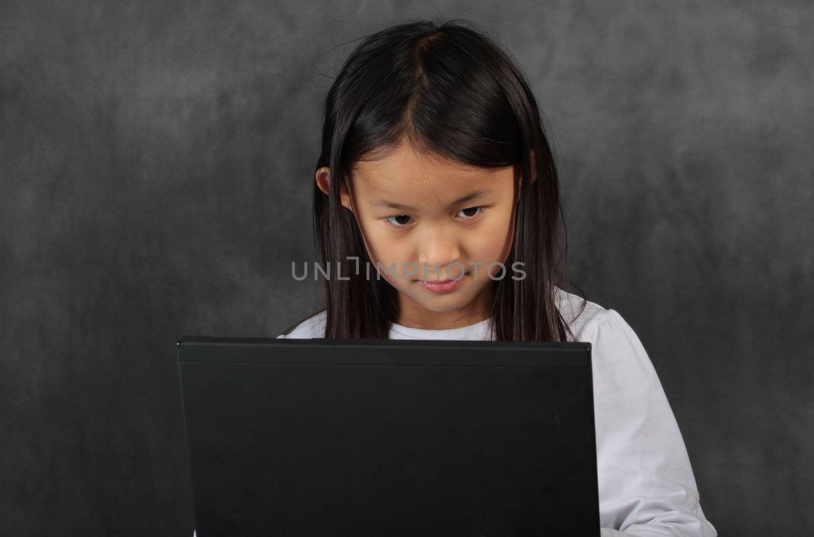 young child - girl- with computer keyboard