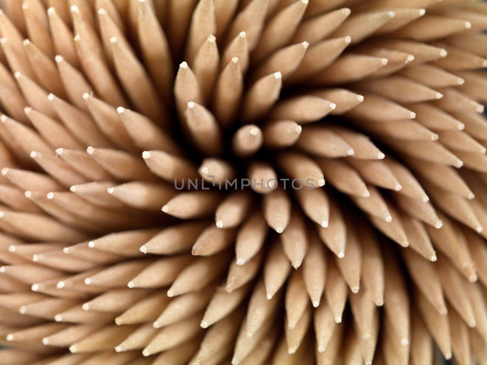 A close up shot of a wooden toothpicks on white