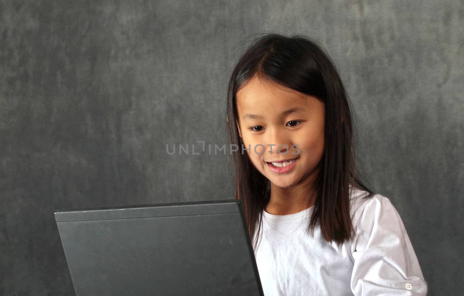 young child - girl- with computer keyboard