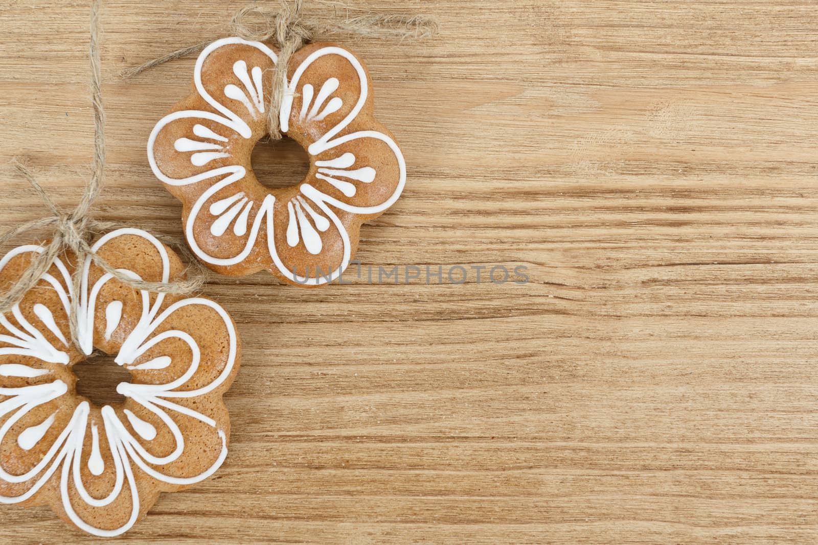 two gingerbread cookies on wooden background