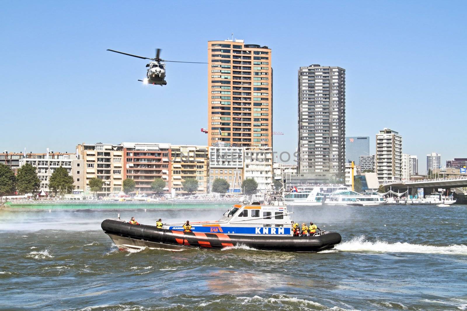 ROTTERDAM, NETHERLANDS - SEPTEMBER 09: Army helicopter is flying above a lifeboat during the world harbor days on 9 september 2012 Rotterdam the Netherlands