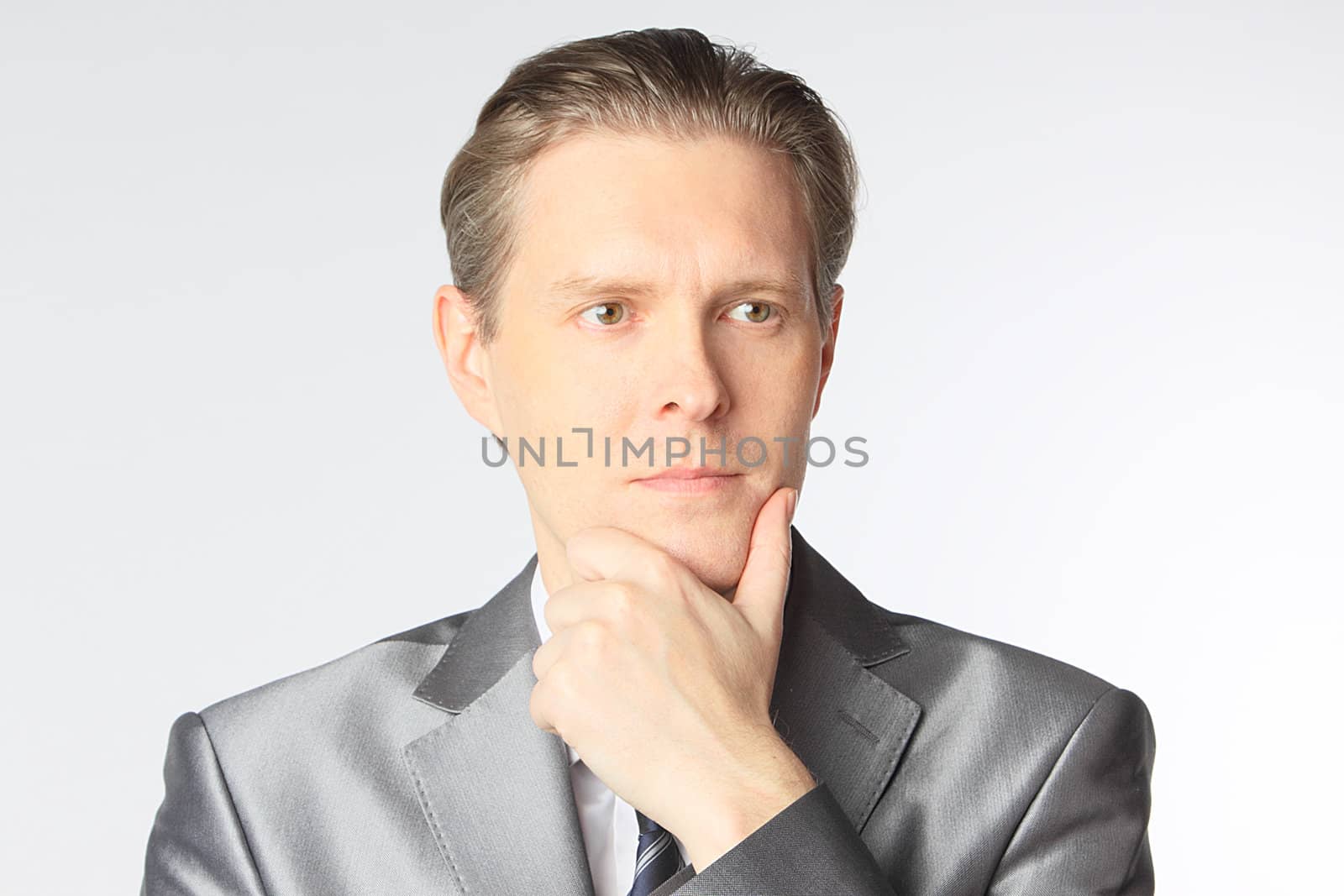 portrait of middle age businessman in austere suit