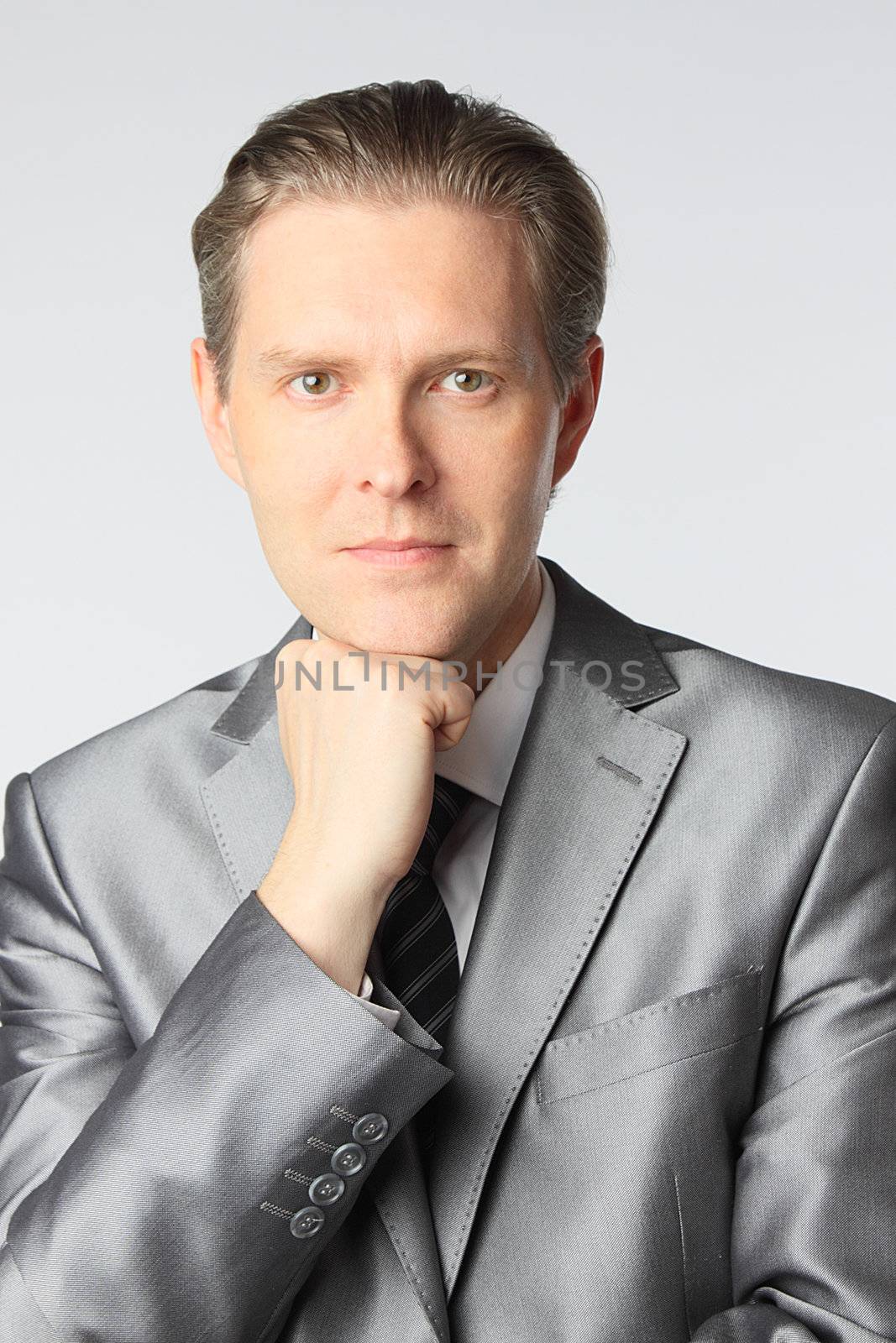 portrait of middle age businessman in austere suit