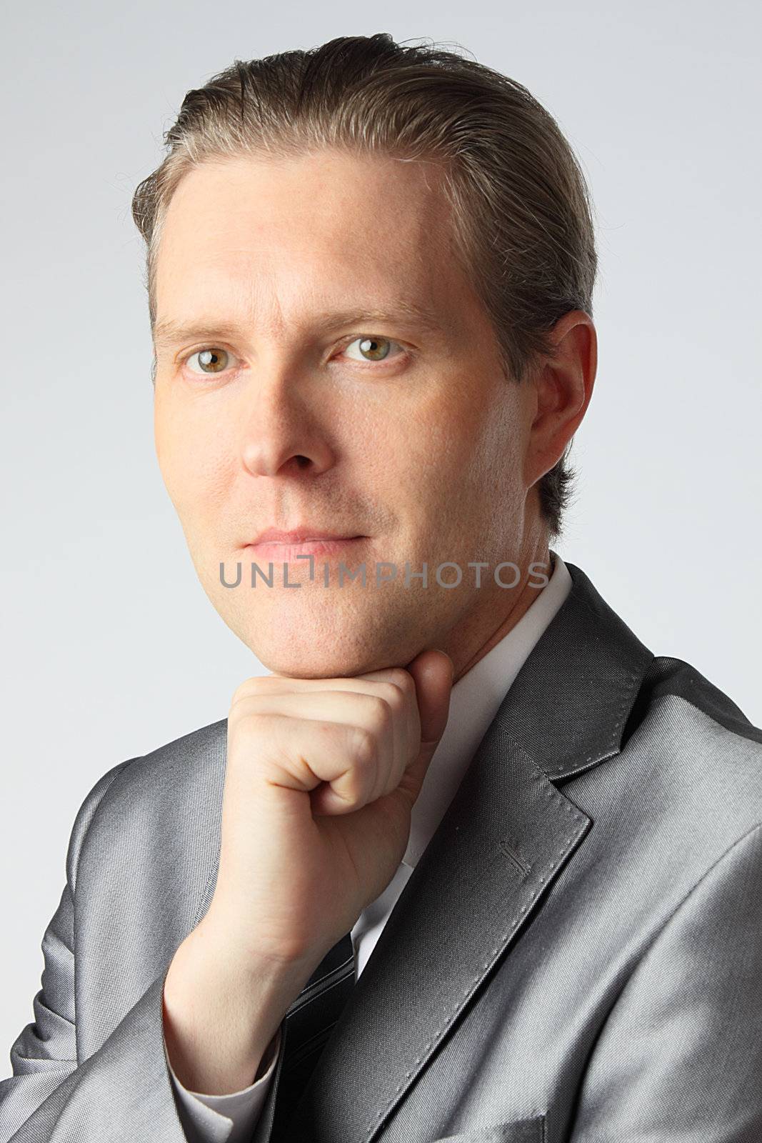 portrait of middle age businessman in austere suit