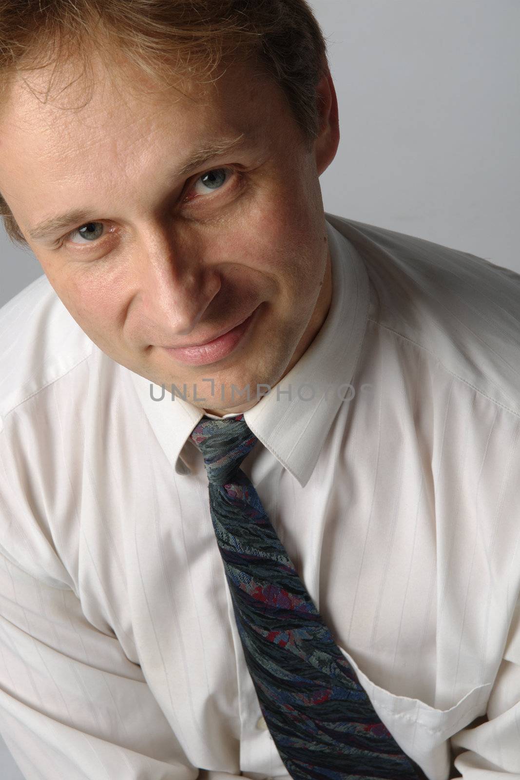 portrait of middle age businessman in austere suit