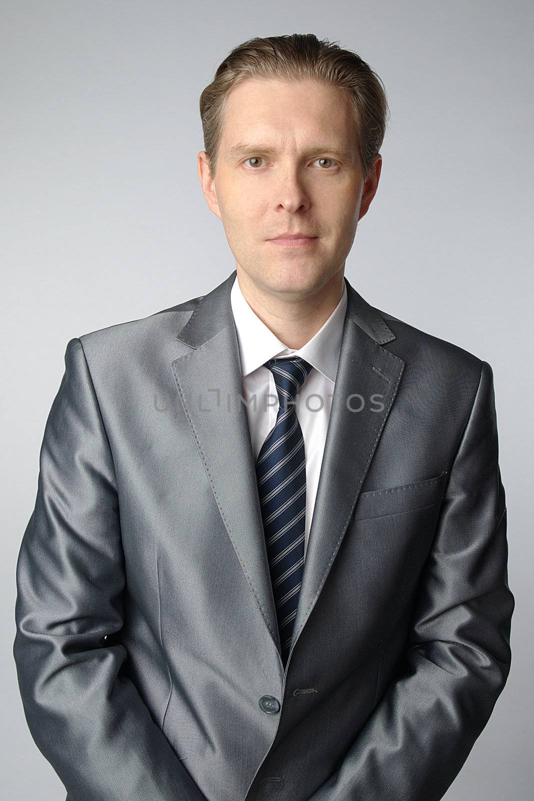 portrait of middle age businessman in austere suit