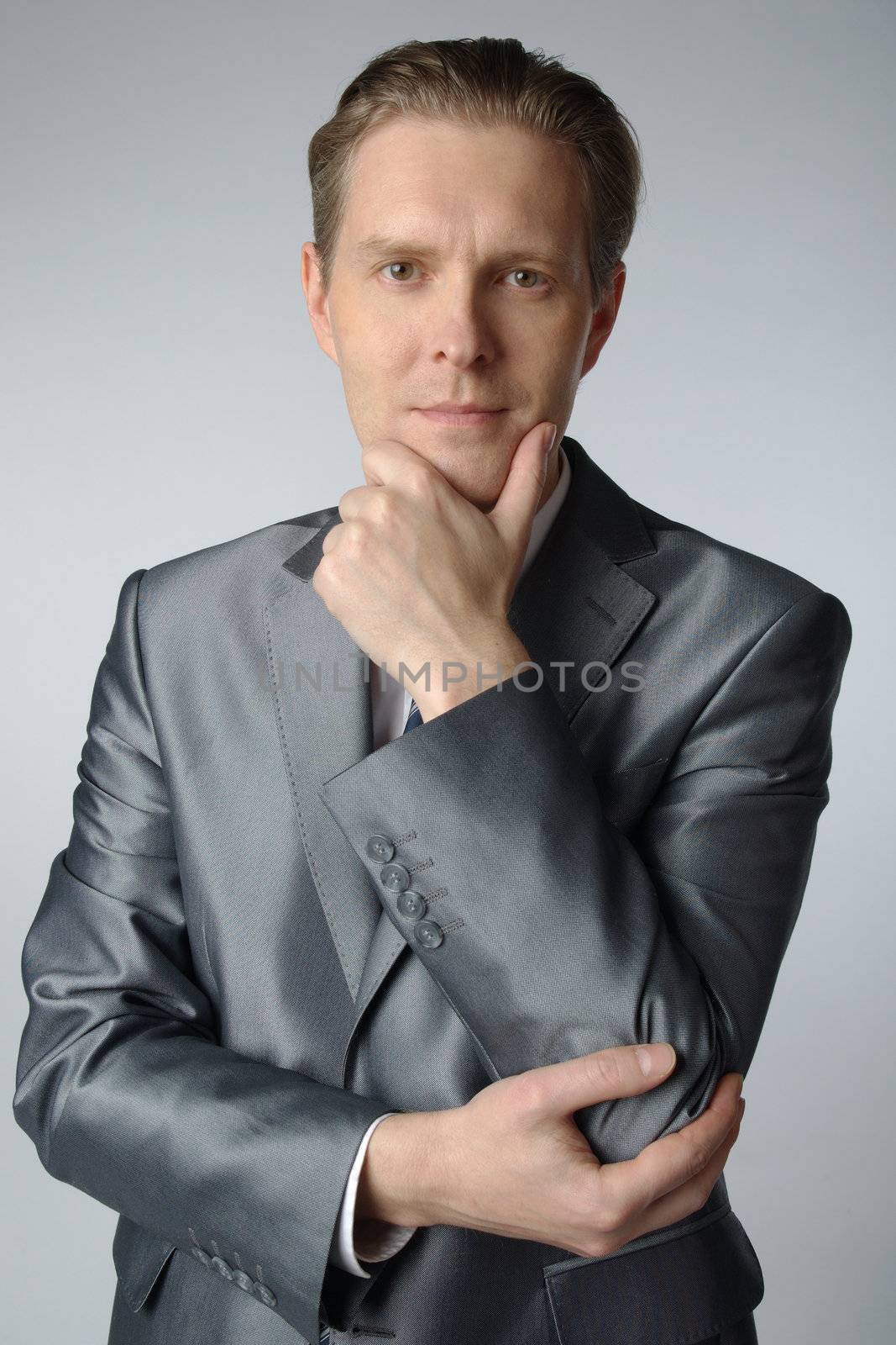 portrait of middle age businessman in austere suit