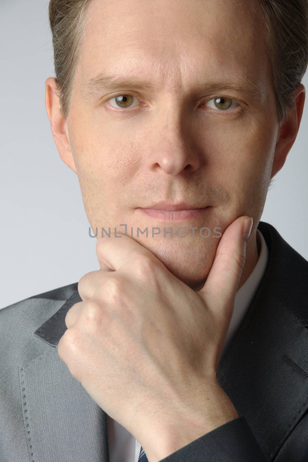 portrait of middle age businessman in austere suit