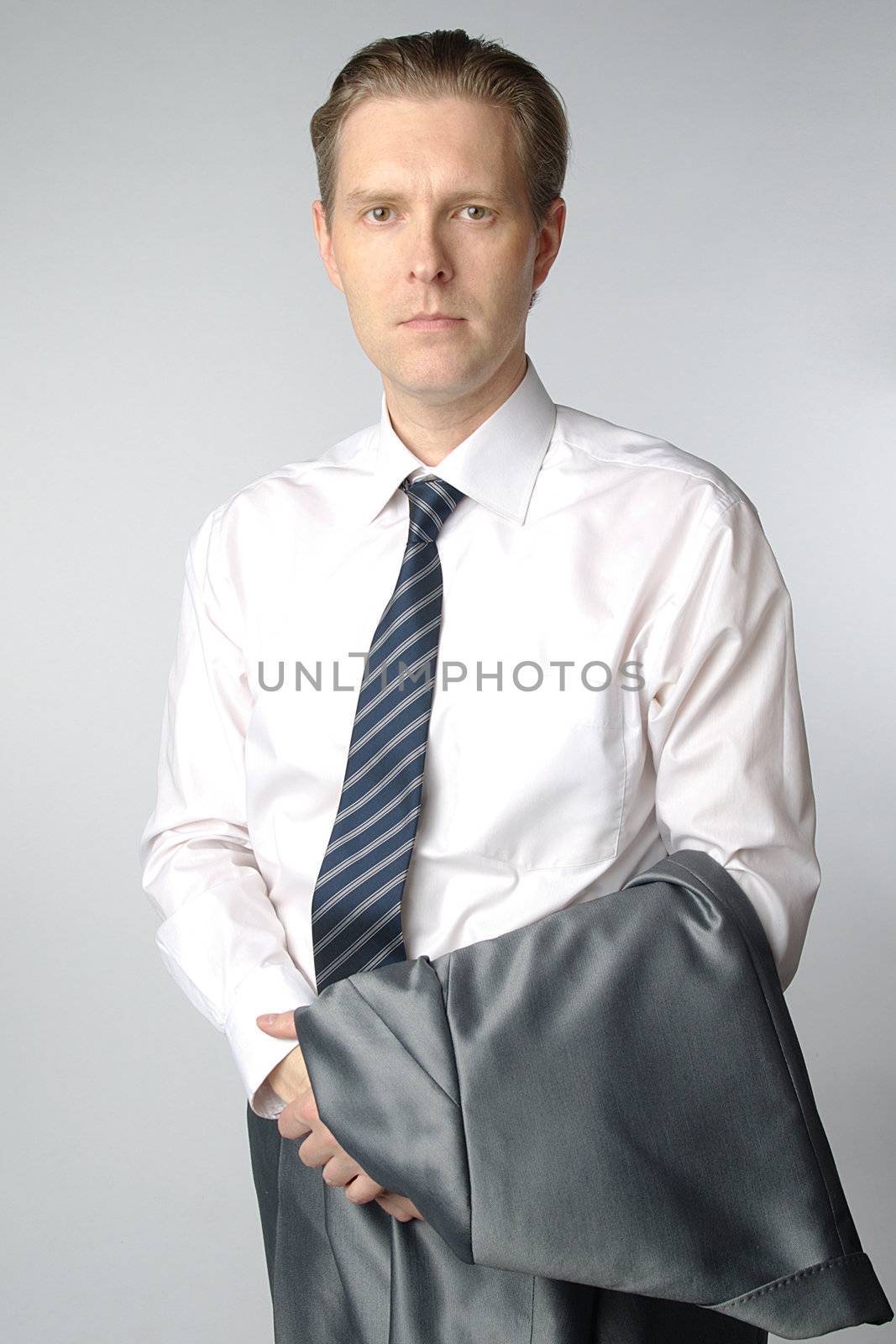 portrait of middle age businessman in austere suit