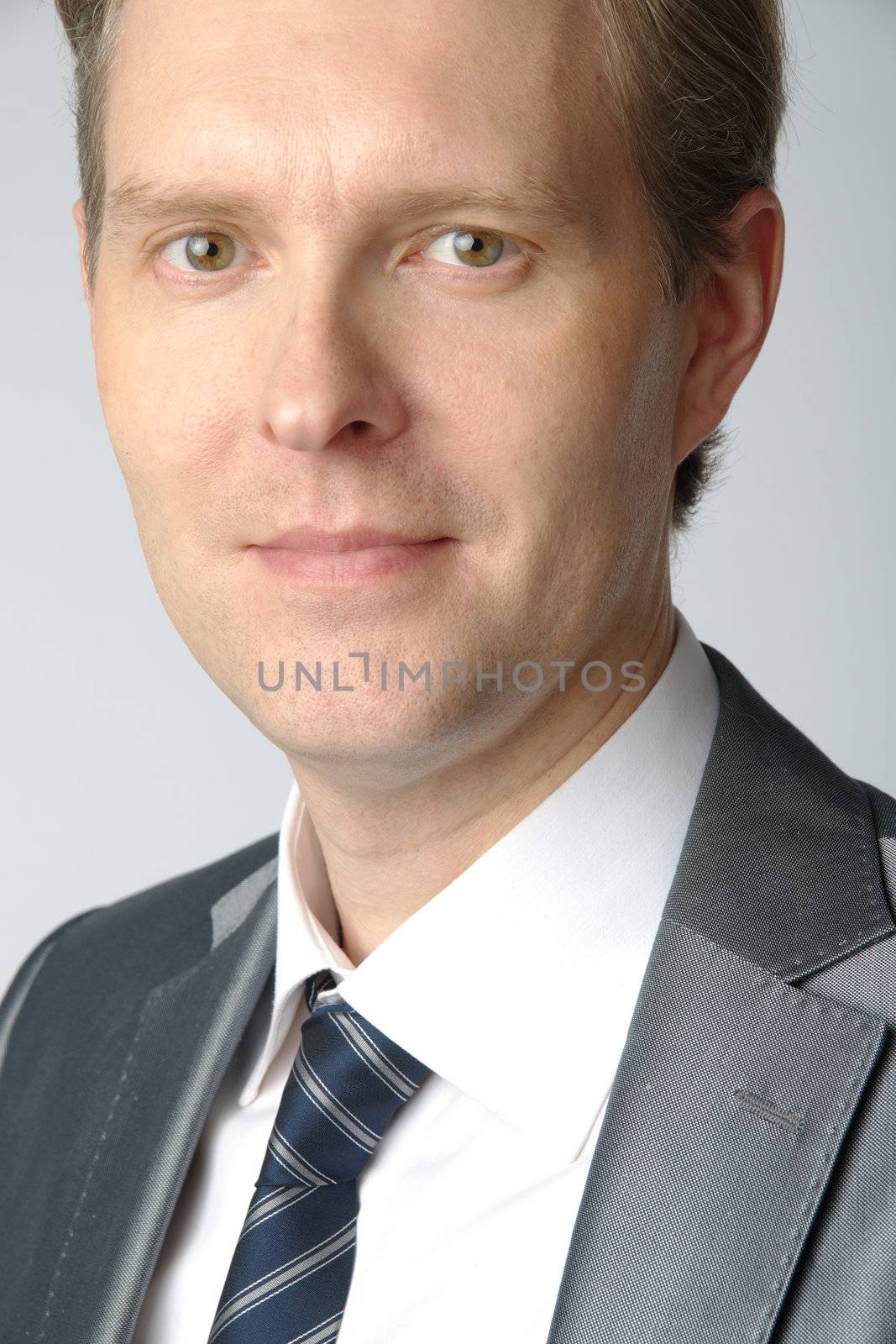 portrait of middle age businessman in austere suit