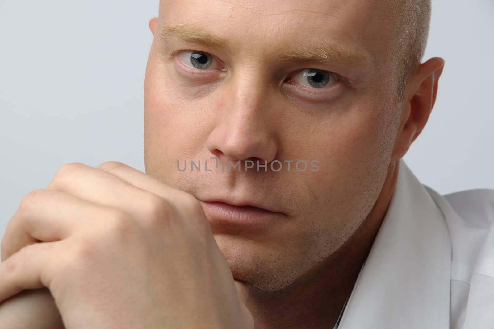 portrait of middle age businessman in austere suit