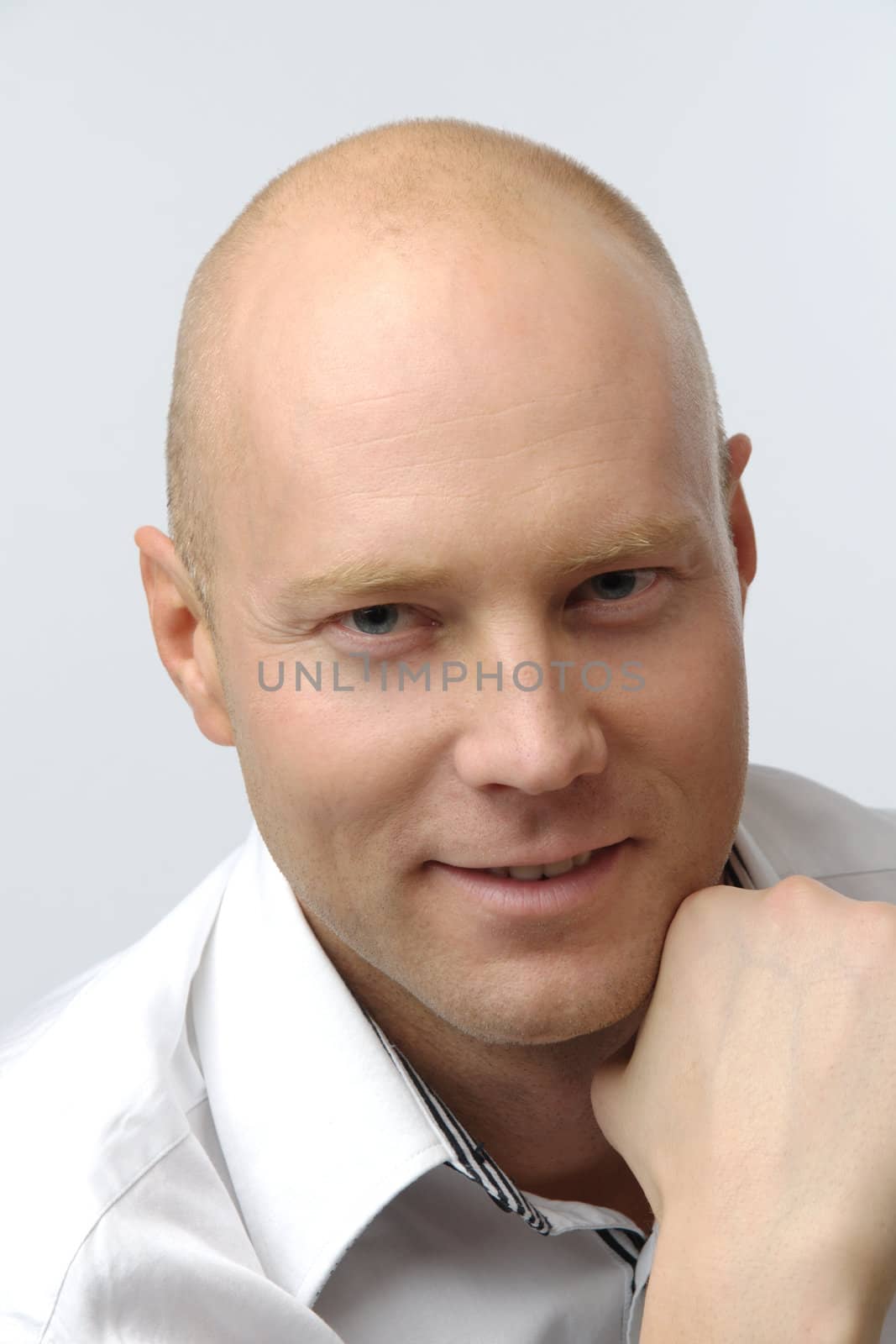 portrait of middle age businessman in austere suit