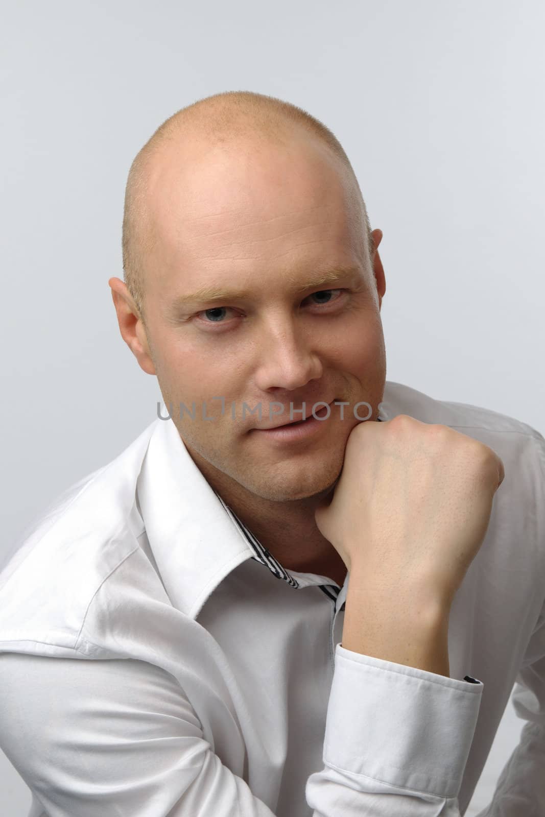 portrait of middle age businessman in austere suit