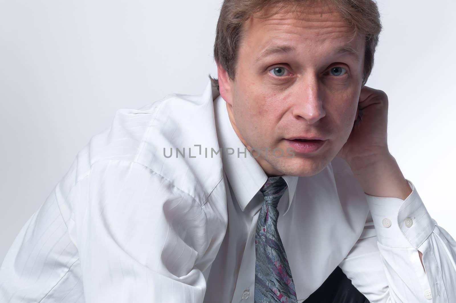 portrait of middle age businessman in austere suit