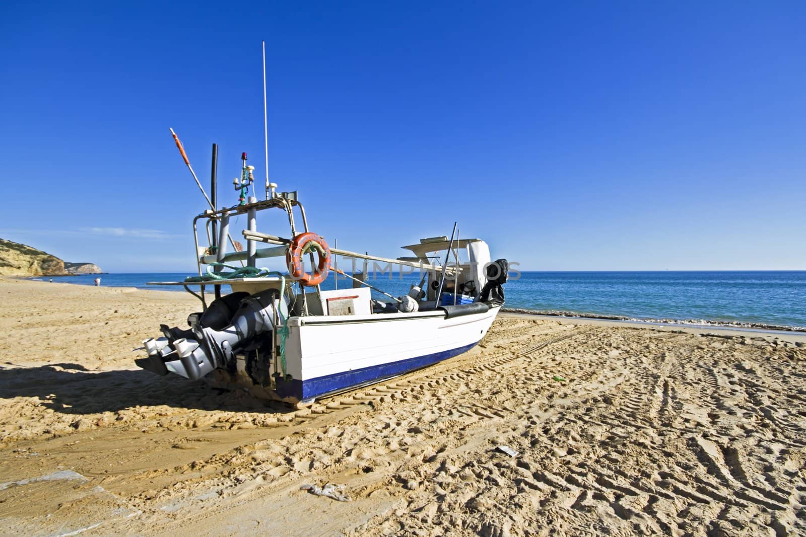 Fishing boat at the beach at Salema in Portugal