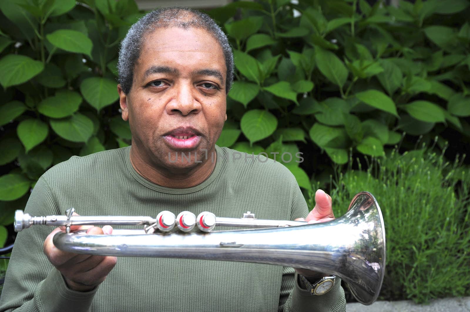 African american male jazz musician with his flugelhorn.
