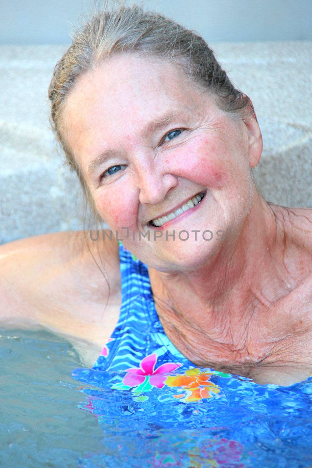 Mature female enjoying her hot tub.