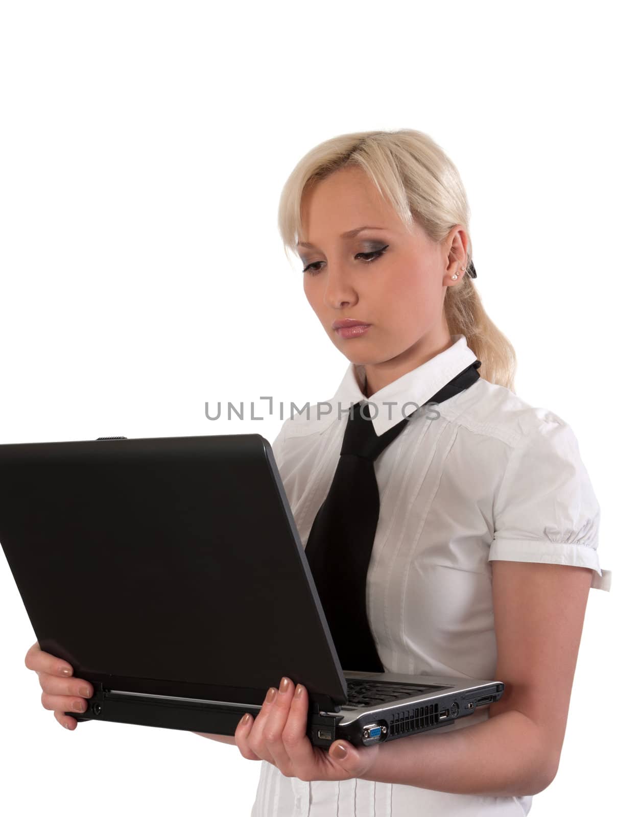 Blond girl working at a laptop isolated on white.