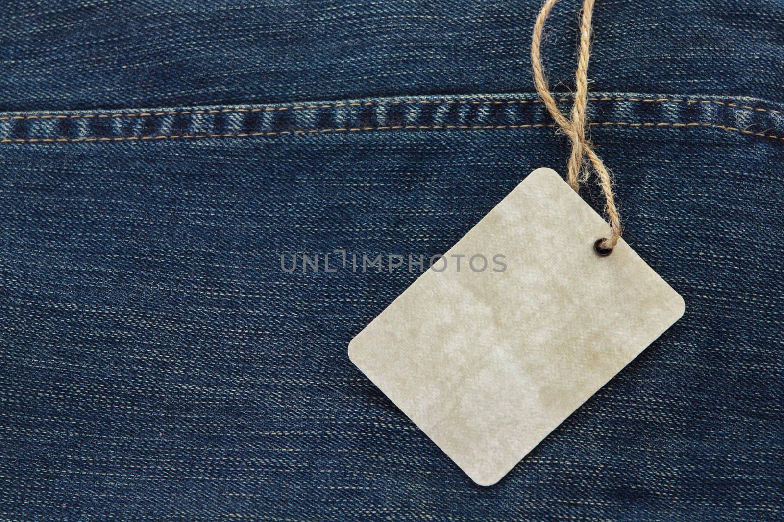 Price tag over jeans background