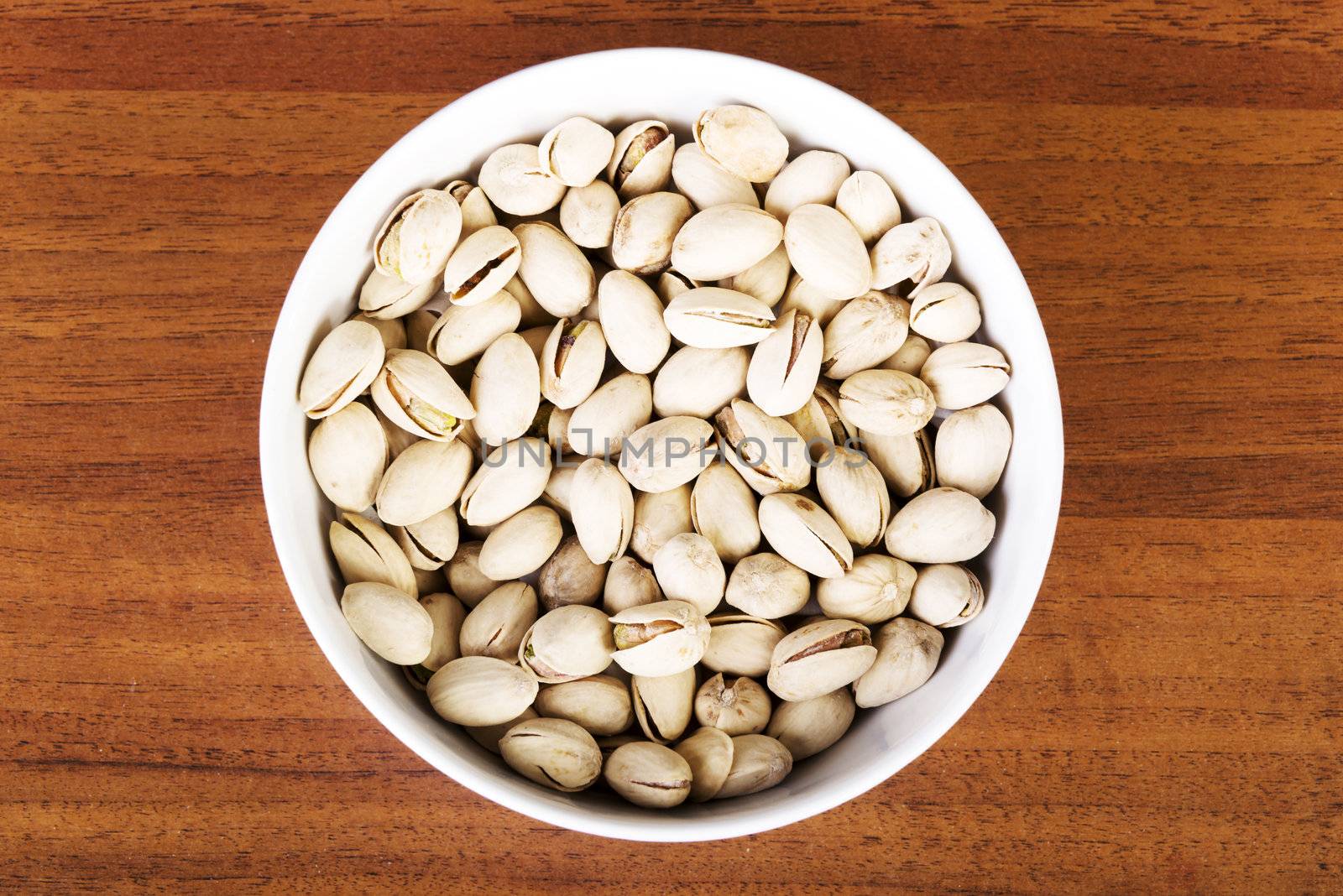 Bowl of pistachio nuts by BDS