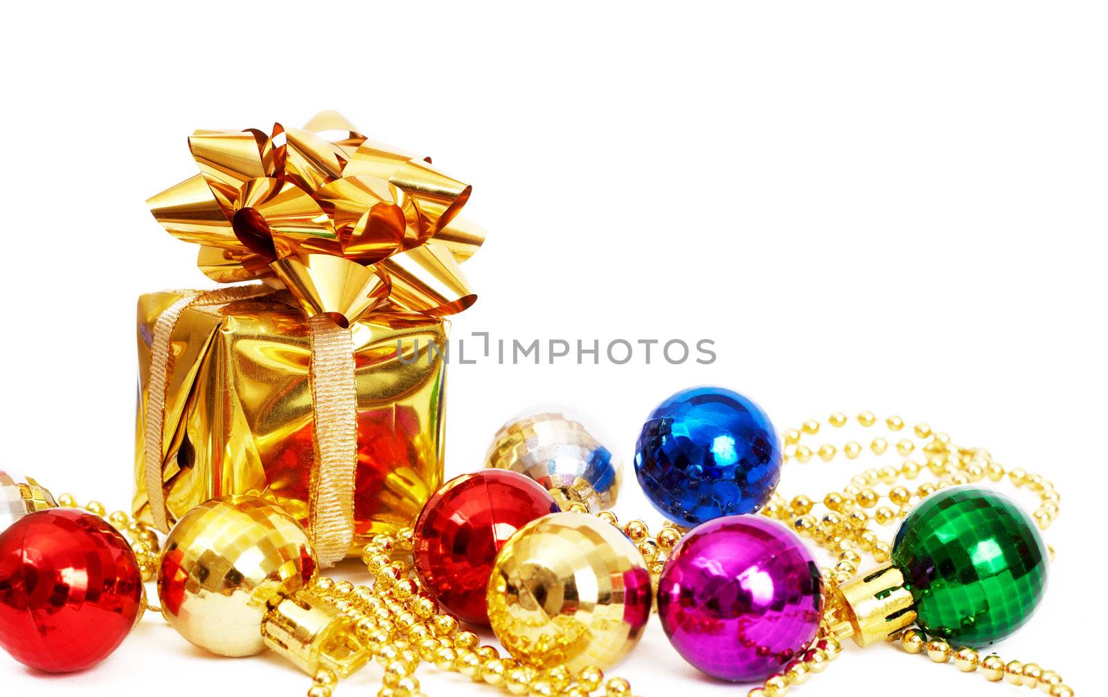 Small gift box and colorful baubles isolated on white background with copy space