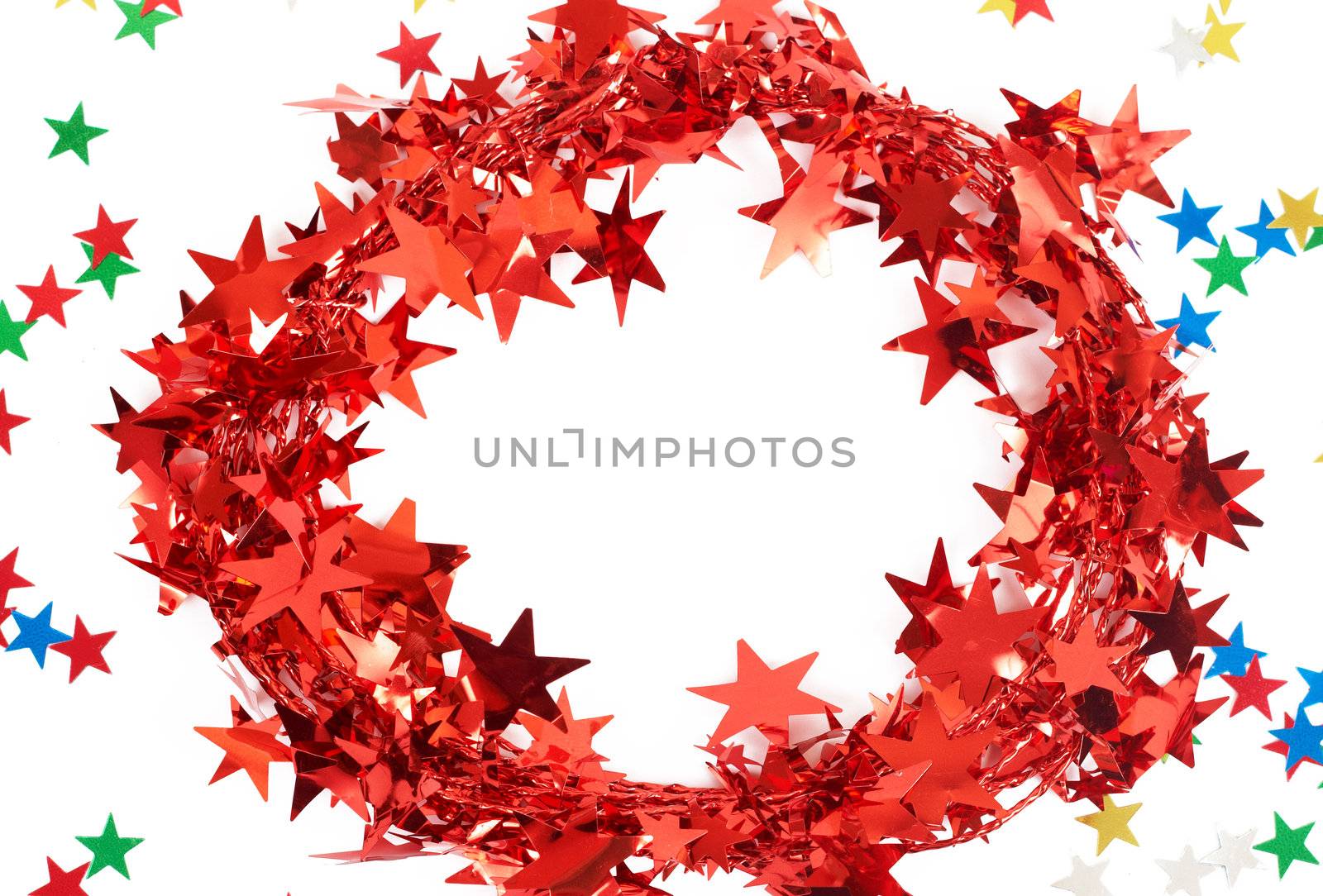 Red Christmas tinsel with stars isolated on white background with copy space. 