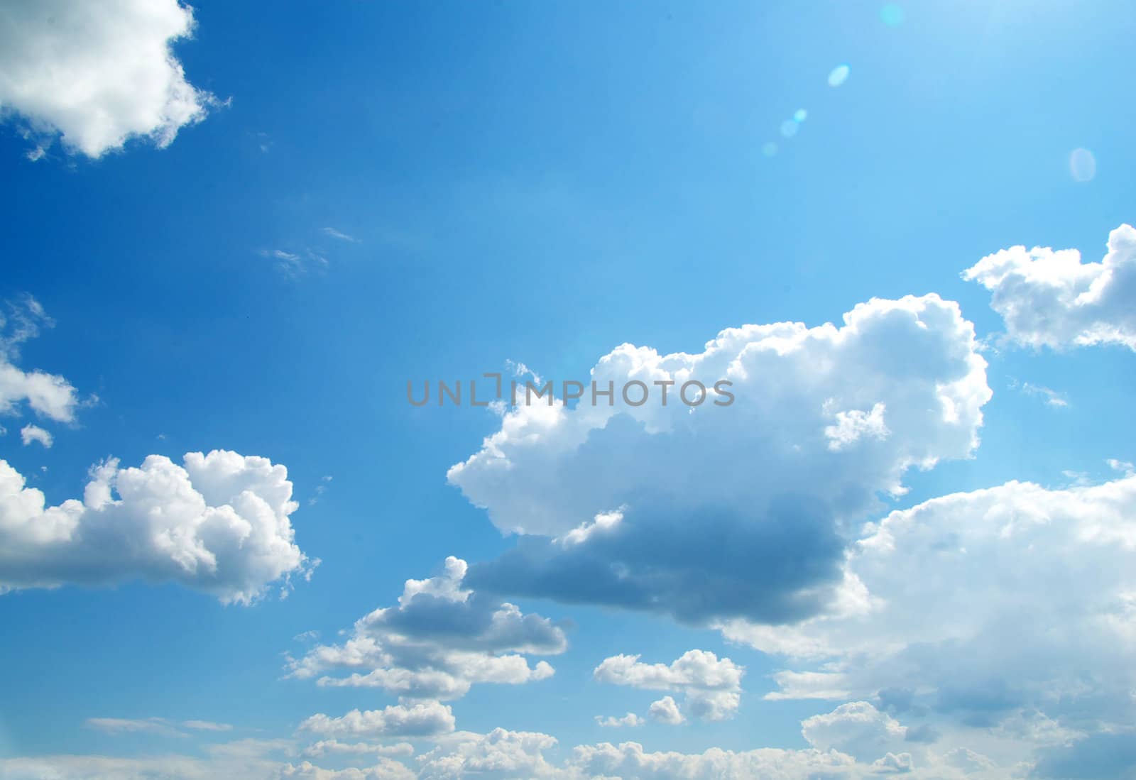 blue sky background with tiny clouds