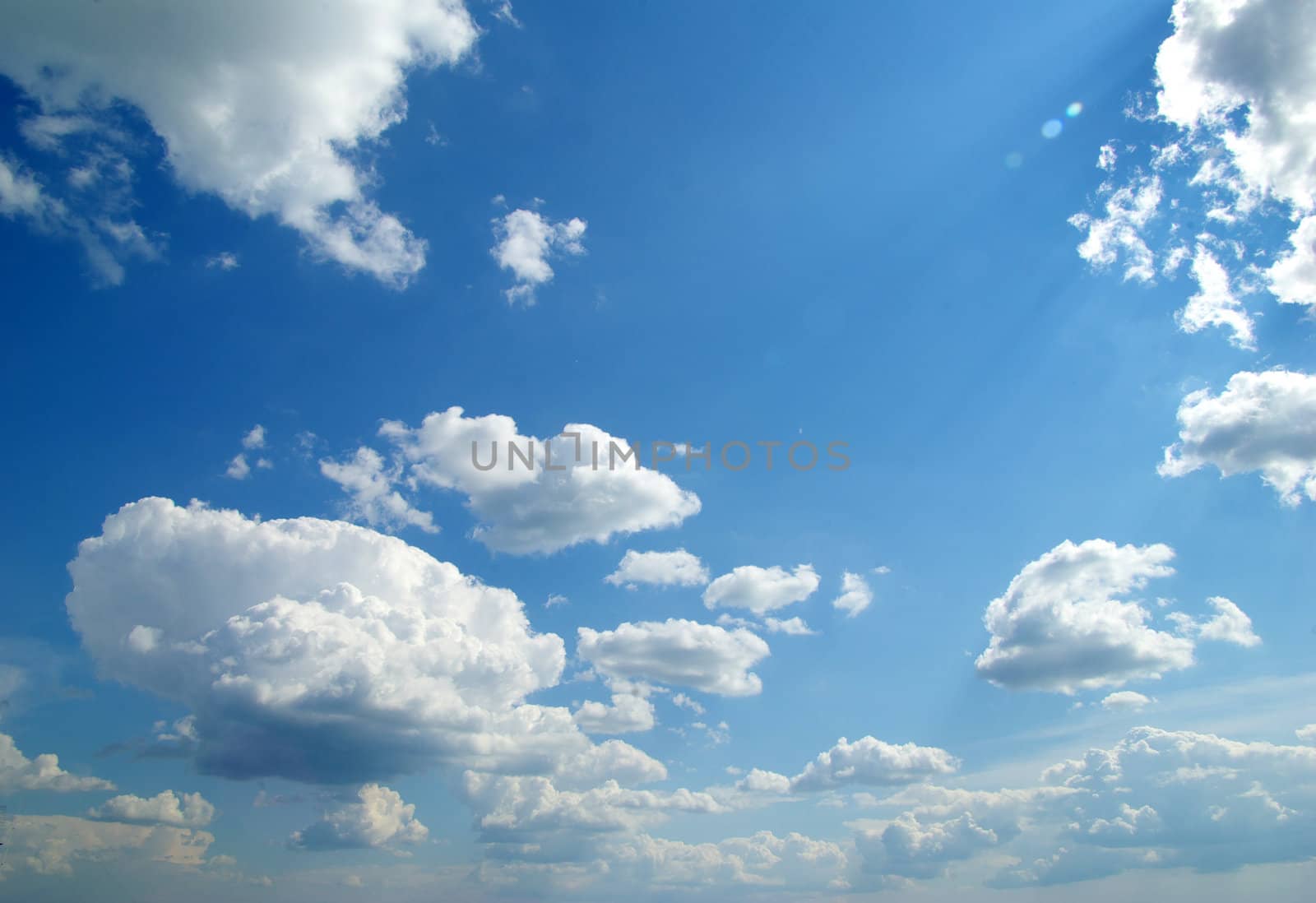 blue sky with clouds and sun