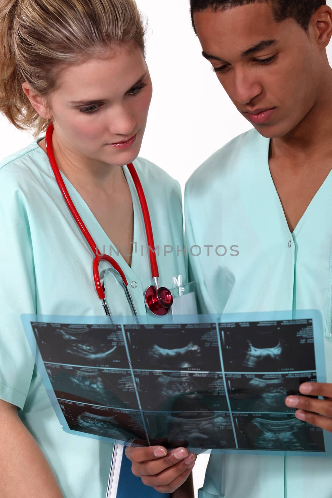 Doctors examining x-ray image