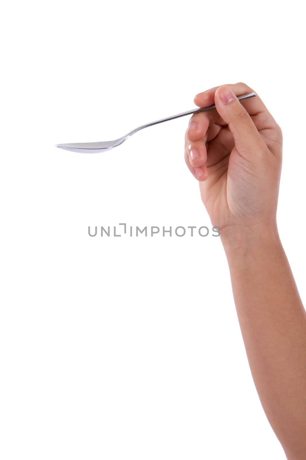 With forearm showing, hand holds empty spoon over white background.