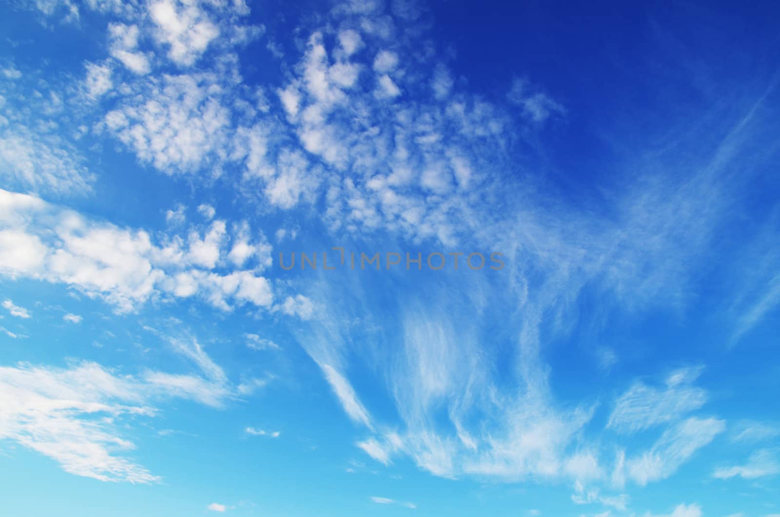 blue sky background with tiny clouds