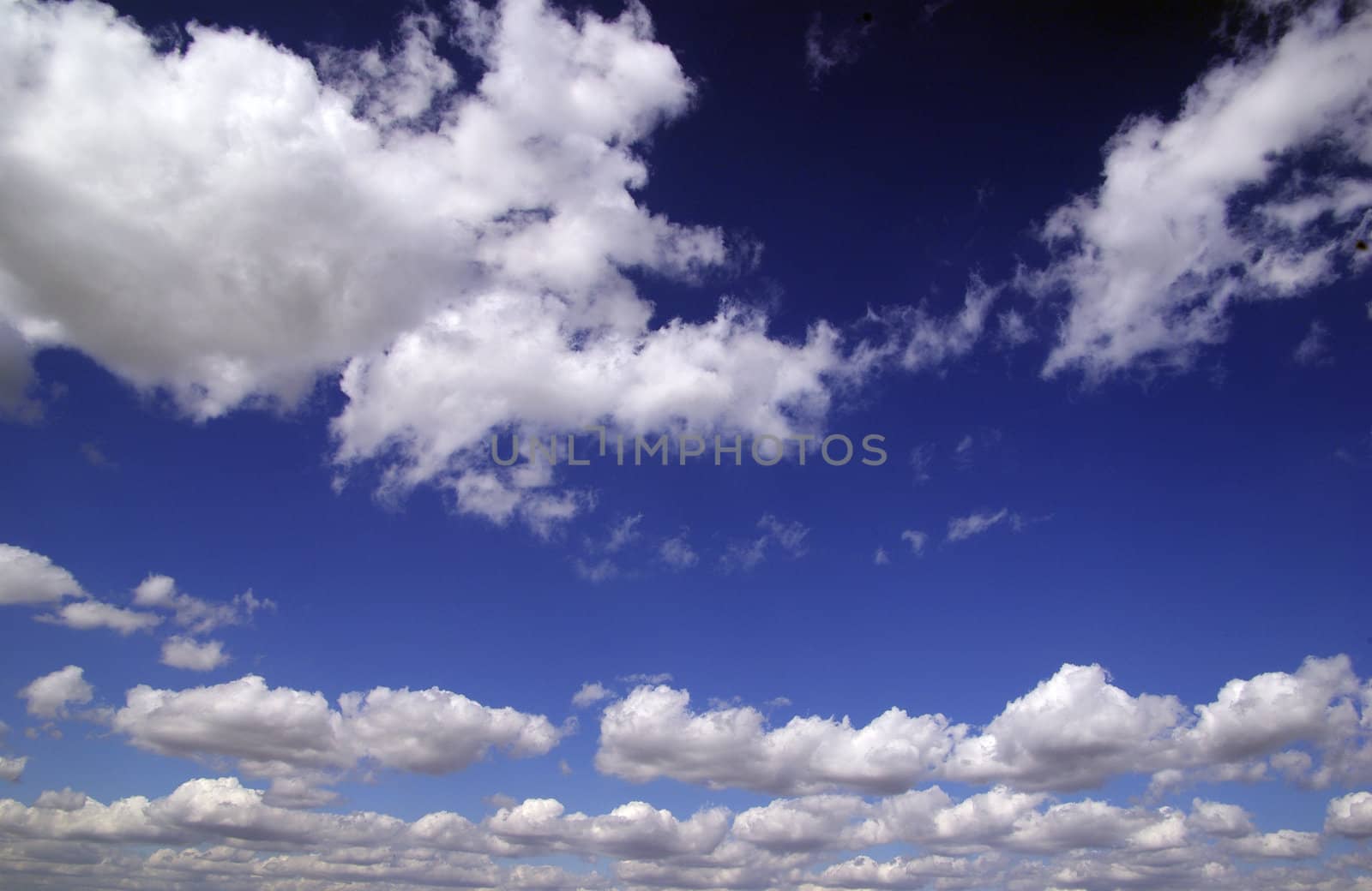 blue sky background with tiny clouds