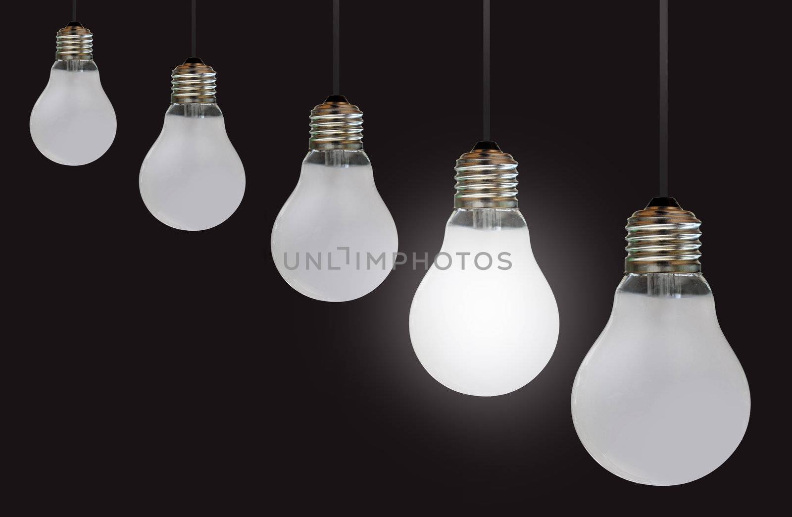 One lit bulb amongst a row of unlit bulbs