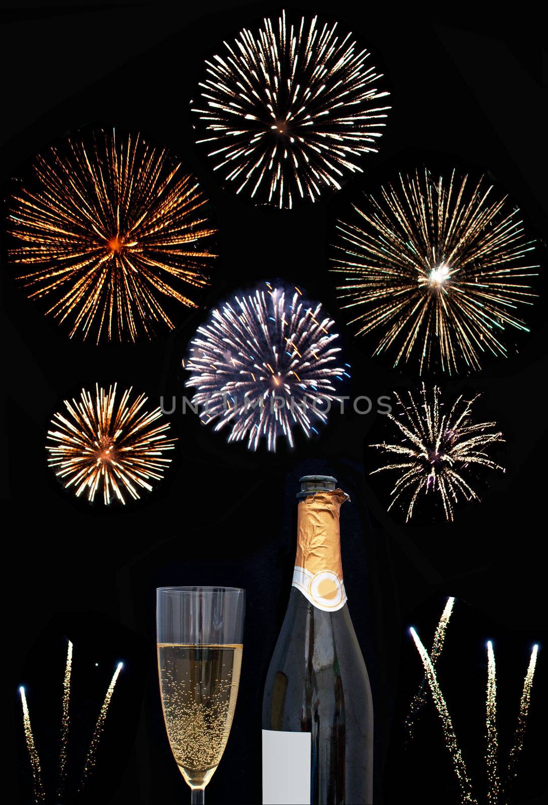 Firework display around a champagne glass and bottle