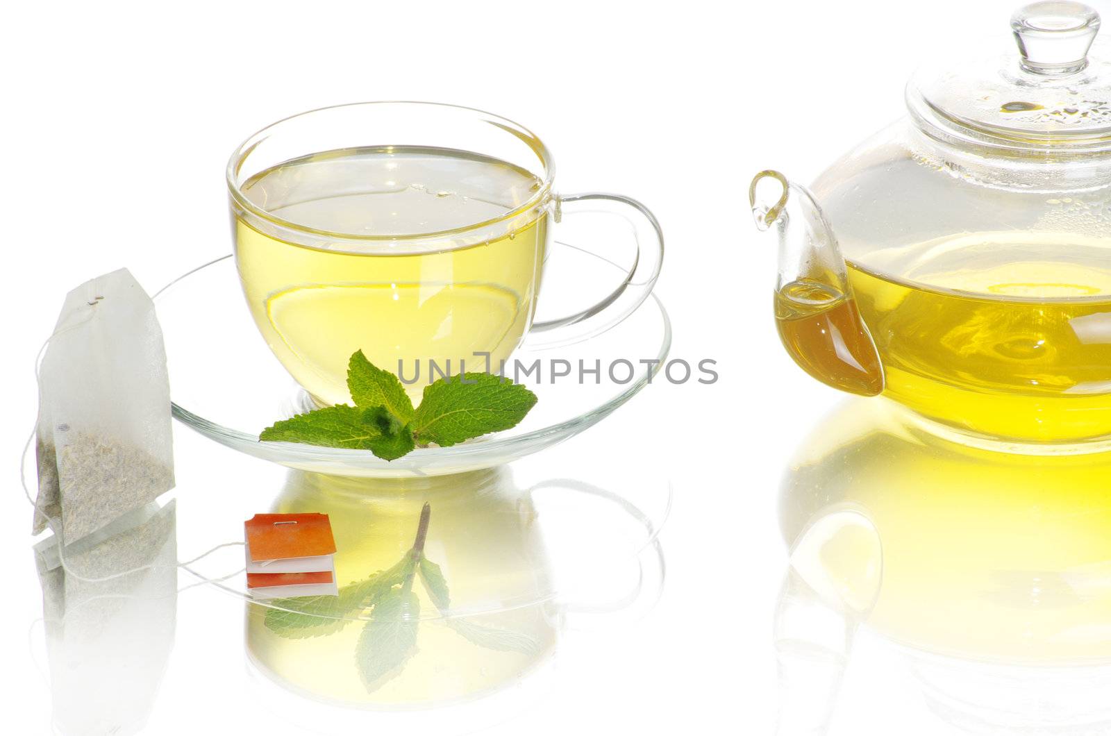 Tea being poured into glass tea cup