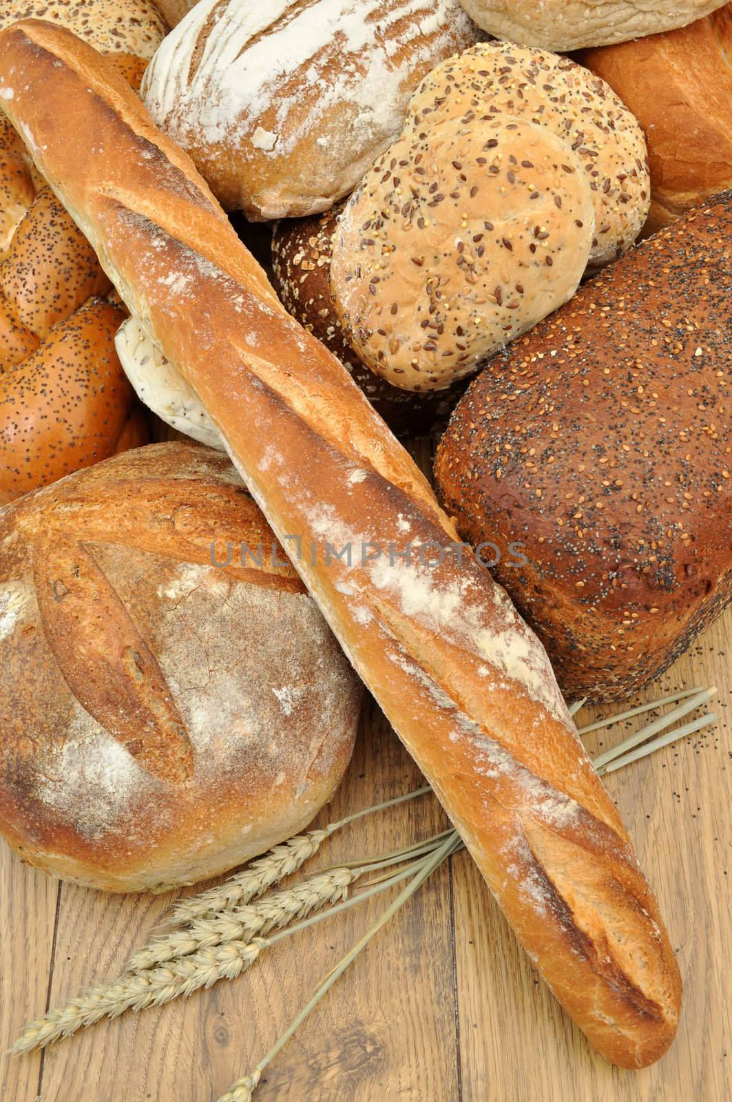 Bakery bread loaves and baguettes with wheat spikes