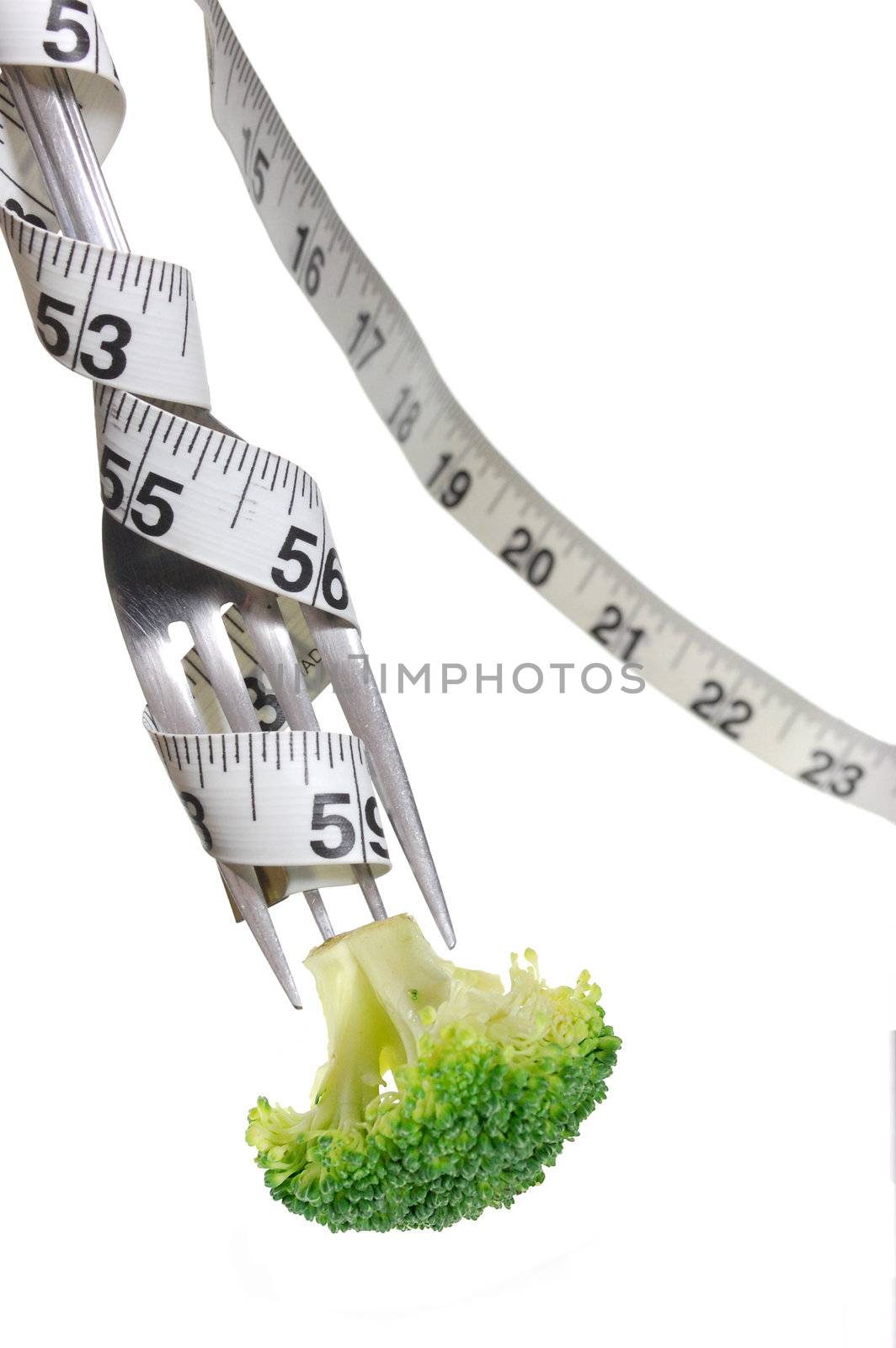 Broccoli on a fork wrapped with a tape measure