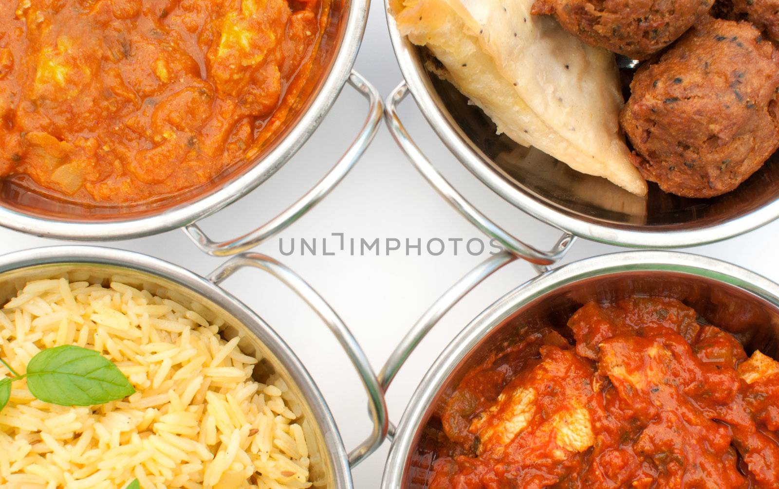 Curry dishes including chicken jalfrezi, tikka masala and samosas