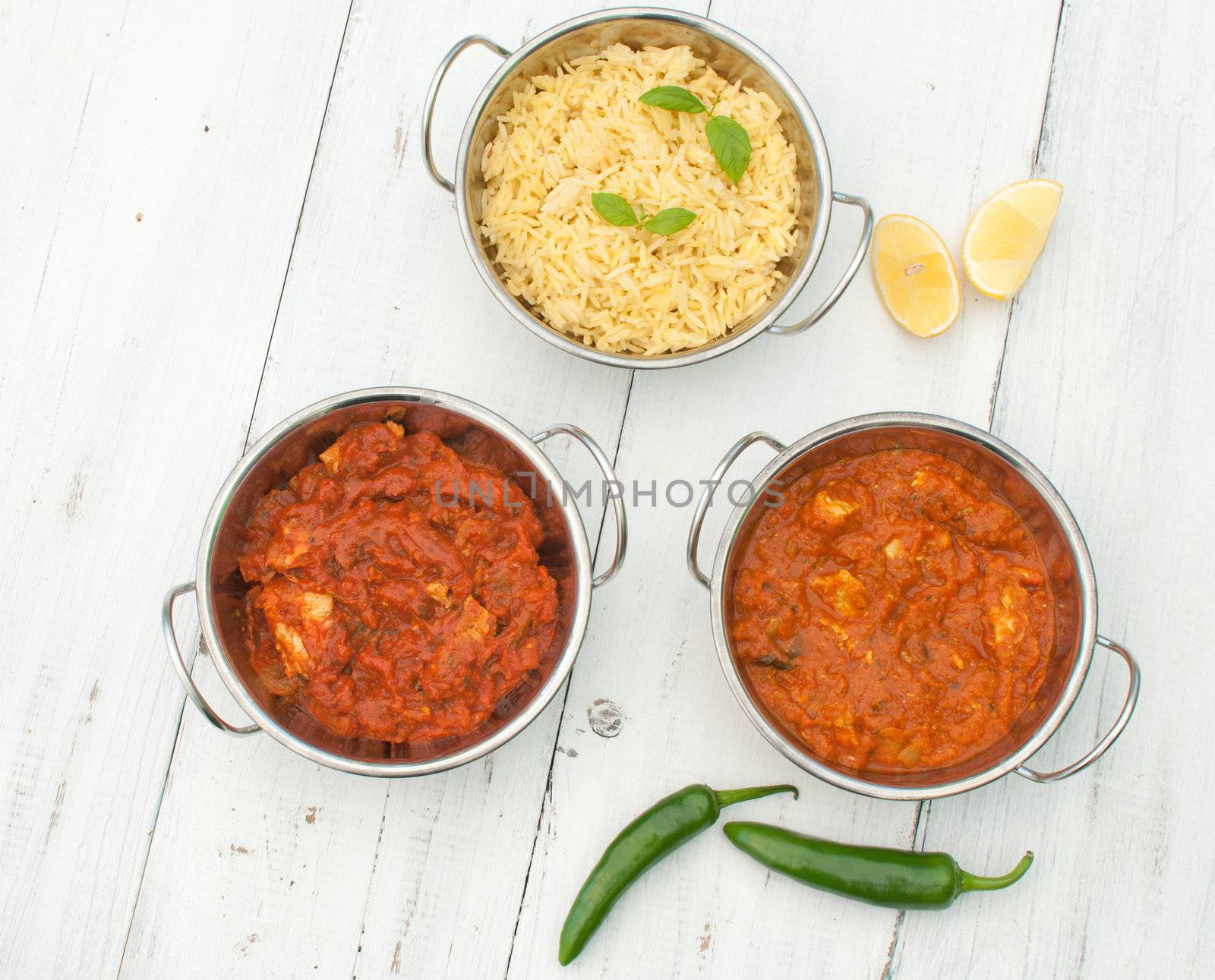 Curry dishes including chicken jalfrezi, tikka masala and pilau rice 