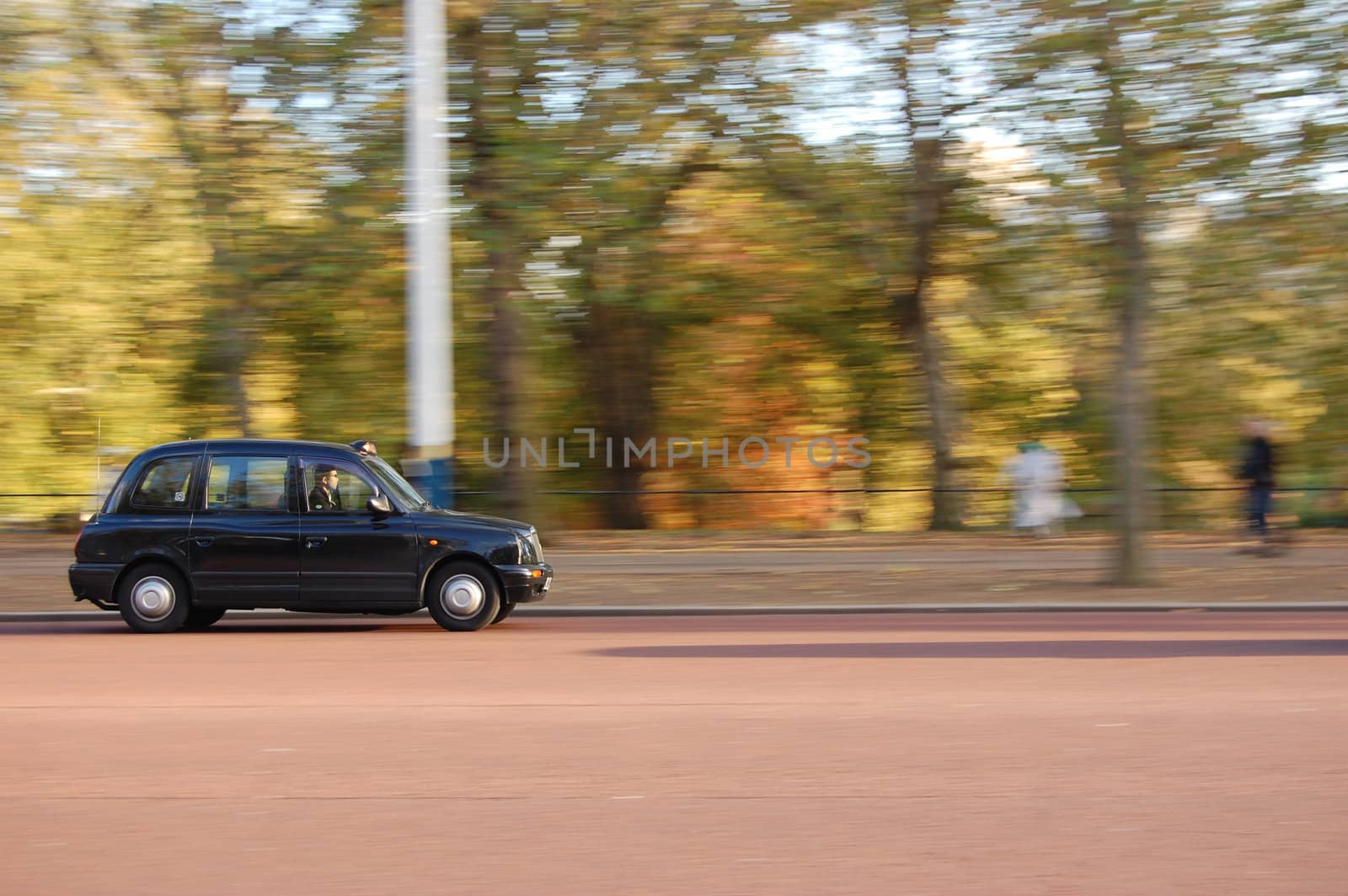 London black taxi passing St James Park near Buckingham Palace