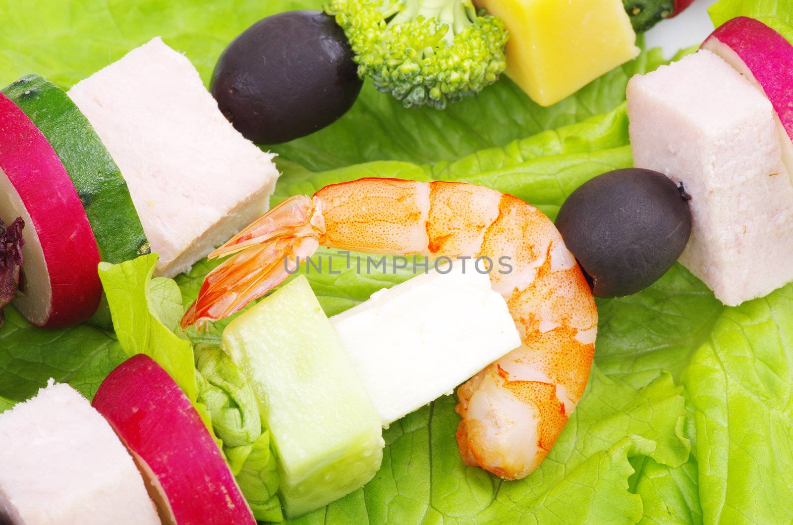 salad with vegetables on green background